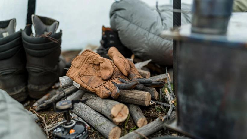 Sitka gunner gloves after cutting wood for shelter