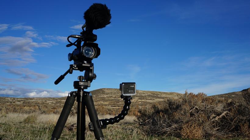 Video camera and gopro on tripod