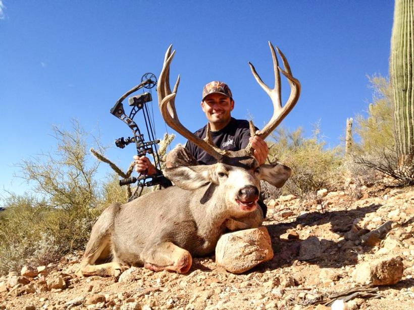 Eric hunt of arizona desert outfitters with an otc archery mule deer