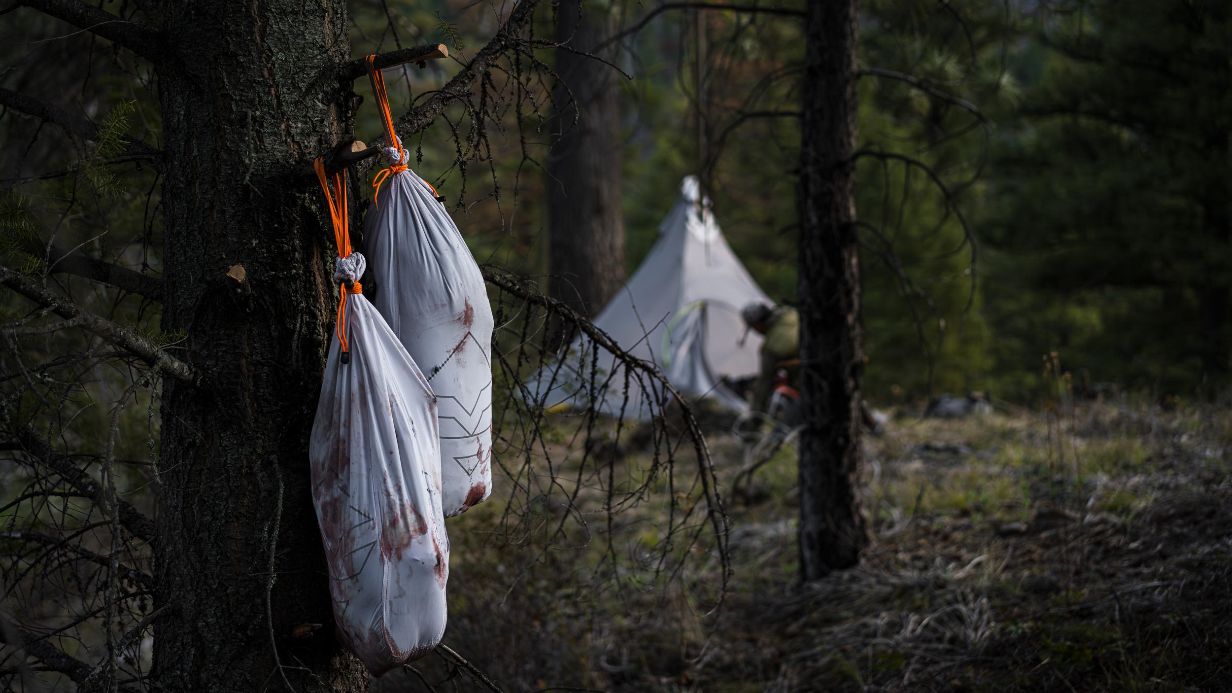 GOHUNT Pack Out Game Bags holding meat at camp