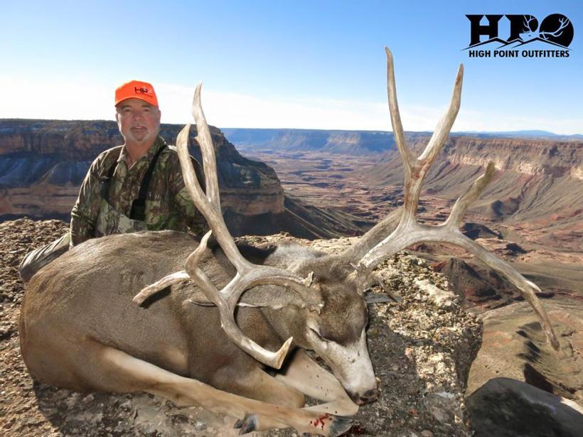 John with a giant arizona mule deer taken with high point outfitters