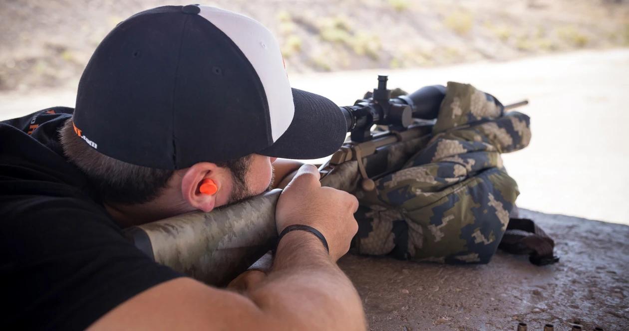 Using hearing protection while shooting browning x bolt rifle close up 1