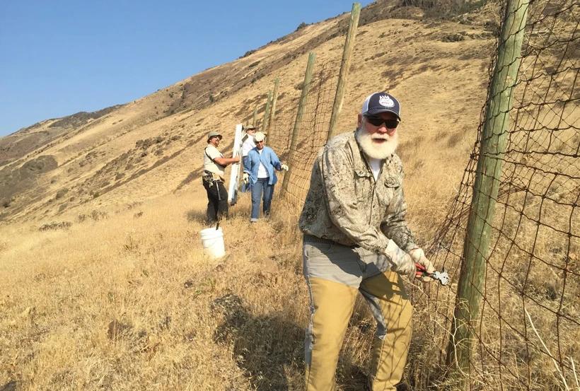 Rocky Mountain Elk Foundation members on a fence removal project