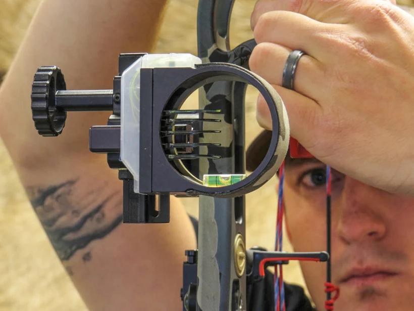 Dave barnett checking axis levels on a bow sight