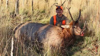 Dave Barnett with a spike elk he took after researching the best area to hunt using tool found on GOHUNT