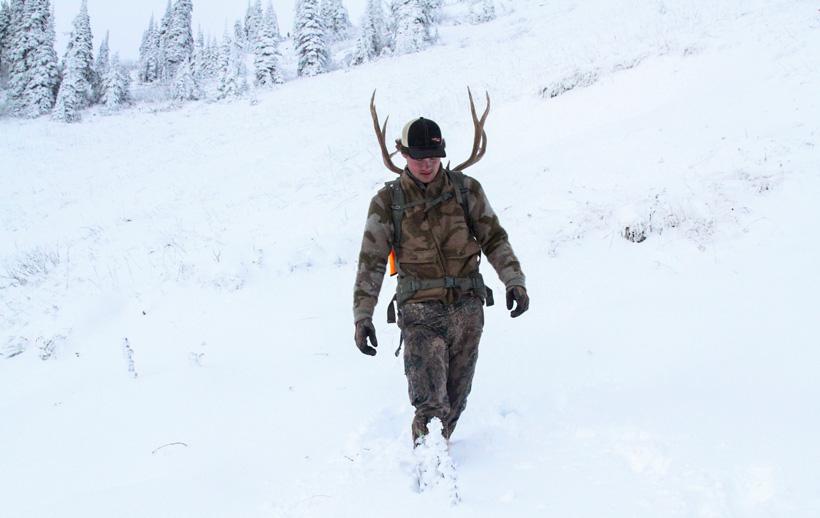 Easton enott packing out his high country montana mule deer