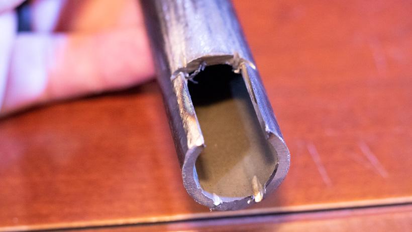 Muzzleloader sight shim cut out of pipe