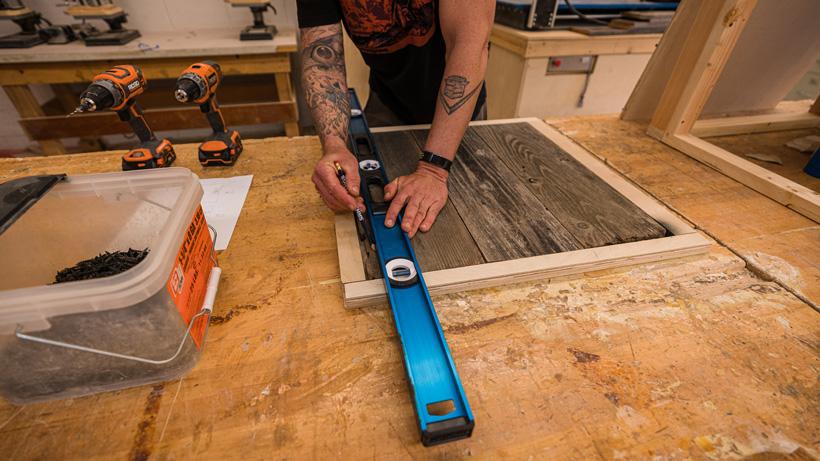 Marking where to burn the barn wood