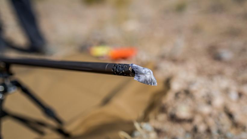 Cleaning patch through rifle barrel