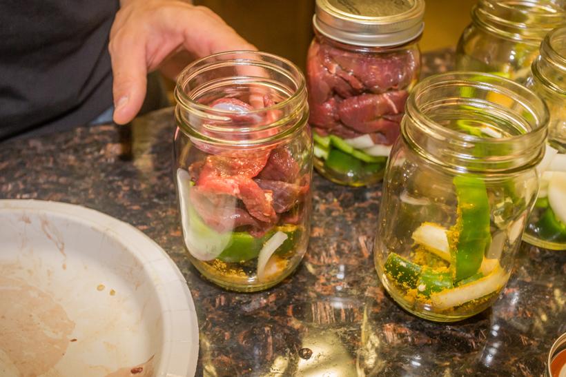 10 filling jars with meat