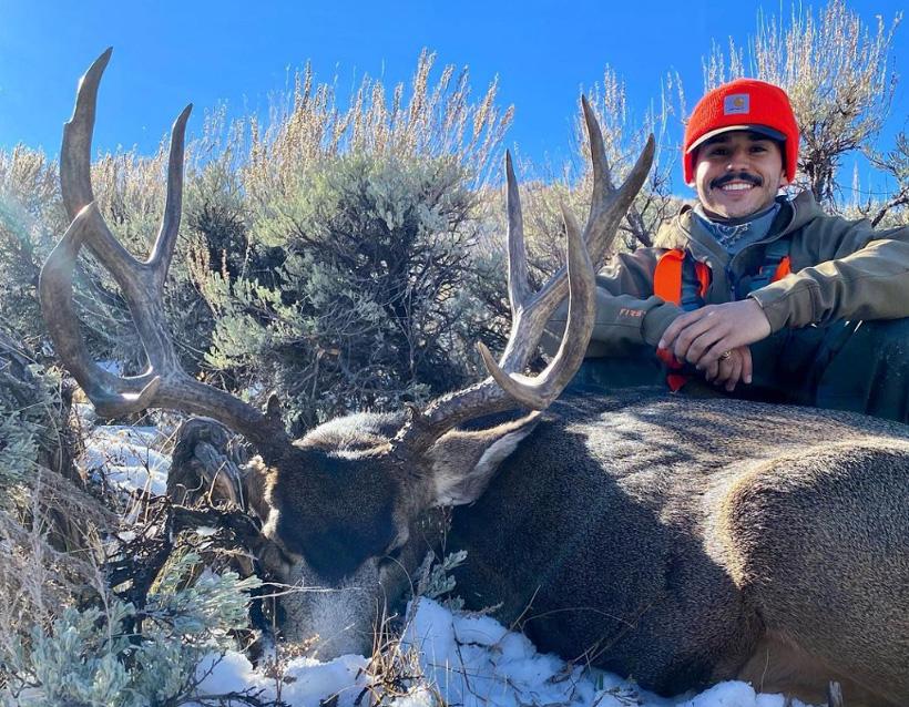 Garrison kinsel with his mule deer buck