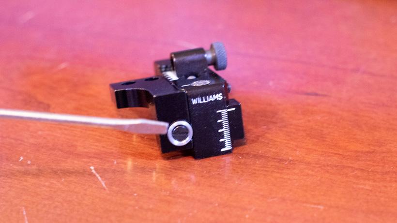 Removing screw for elevation knob on muzzleloader