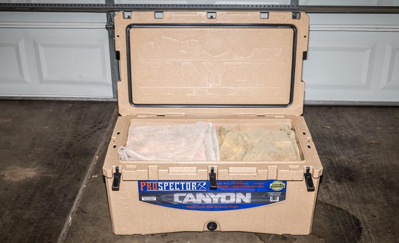 Adding towels to cooler to remove air