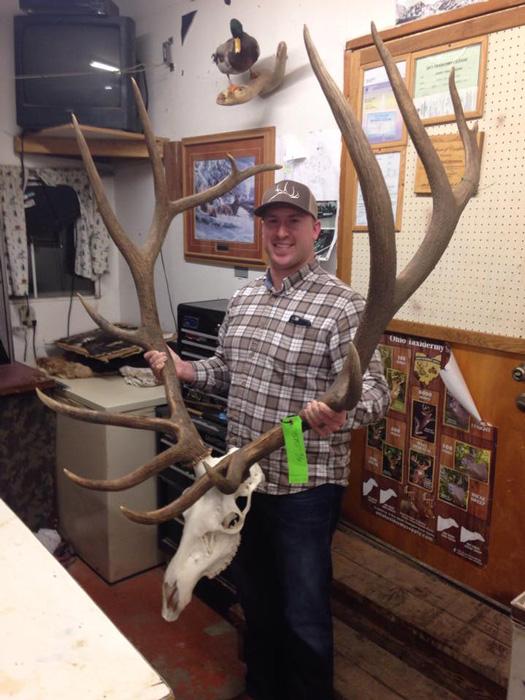 Andrew douglas holding his washington archery bull elk