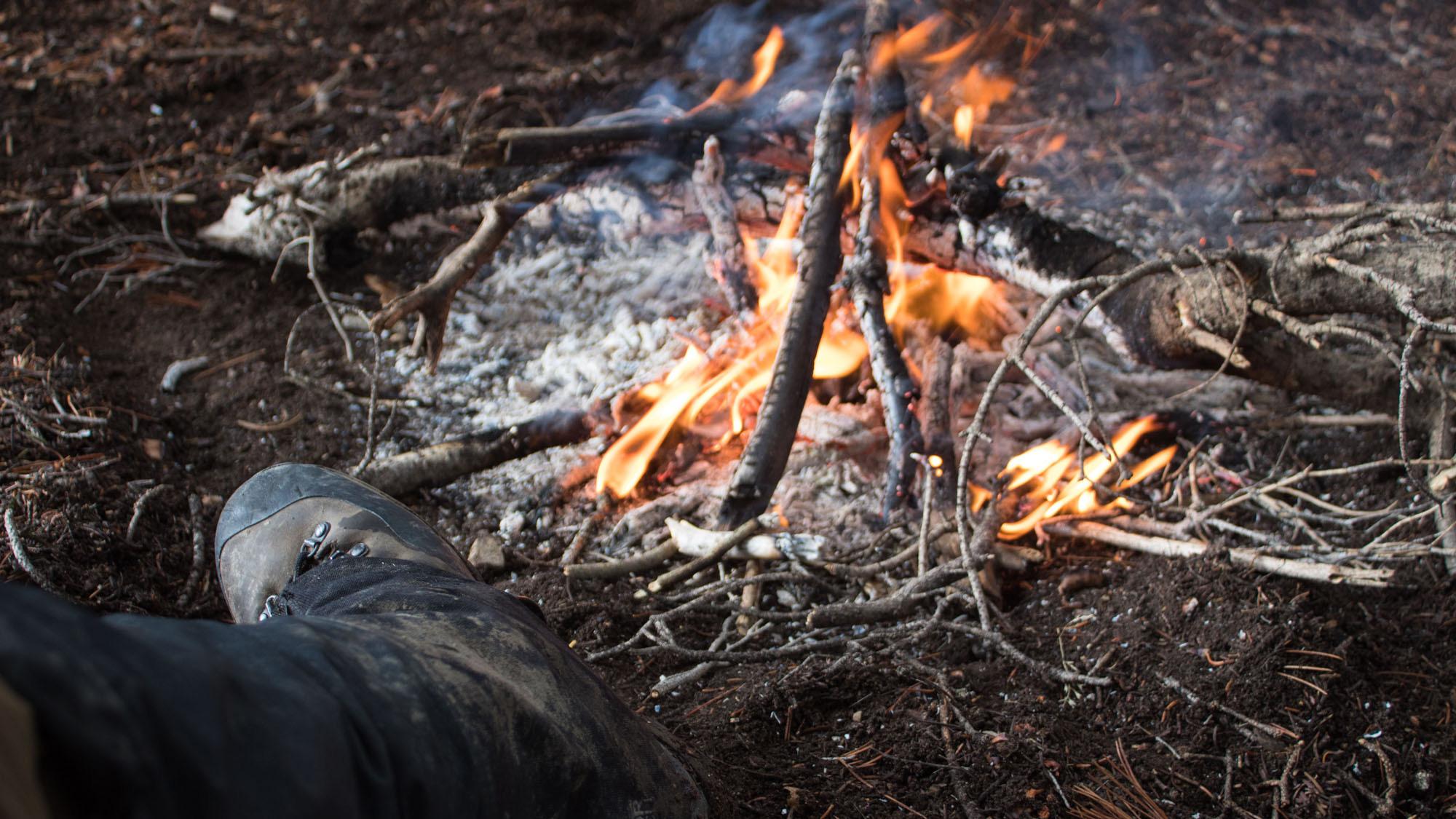 Sitting next to a fire on a late season elk hunt