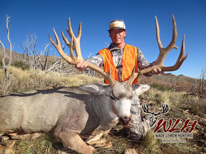 Todd peterson with a henry mountain buck guided by wade lemon hunting
