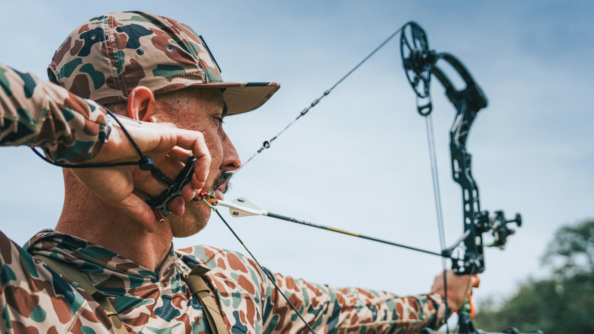 Paul Frame at full draw with a hinge style archery release