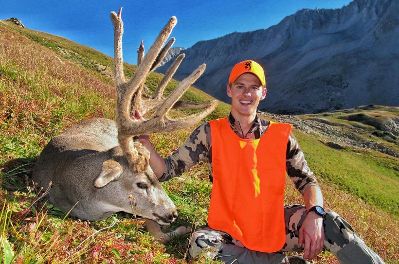 Tyler preszler with his high elevation colorado mule deer