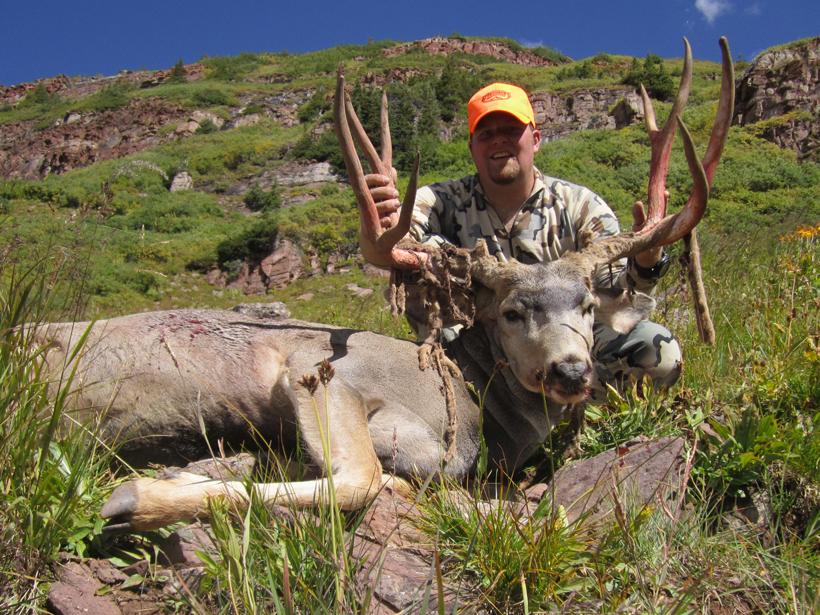 Brandon Evans with an open sight muzzleloader mule deer buck
