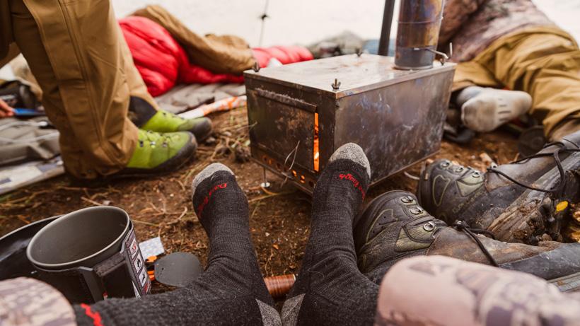 Warming feet up near wood burning stove