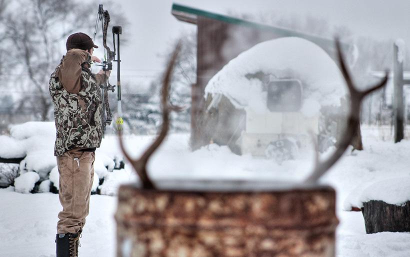 Boiling elk skull while shooting bow
