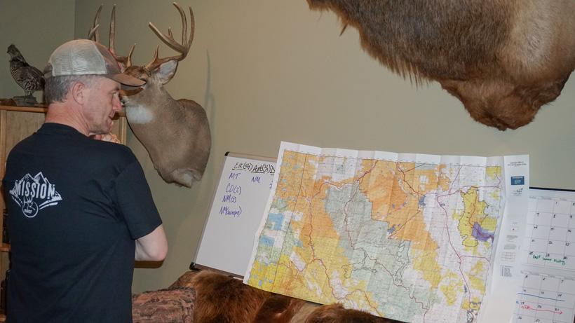 Randy Newberg finding hunting spots on a map