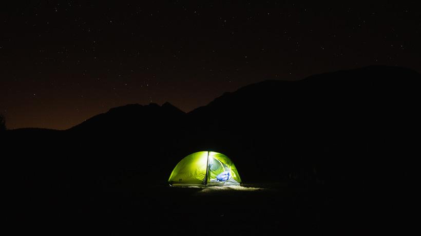 Backcountry campsite at night under the stars